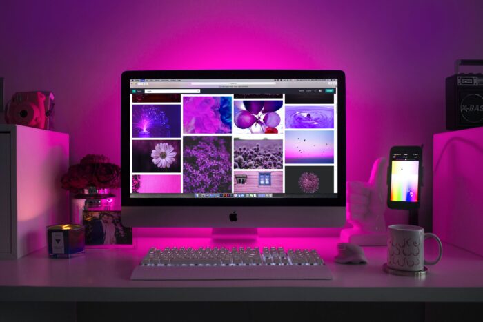 Computer sitting on top of a white desk