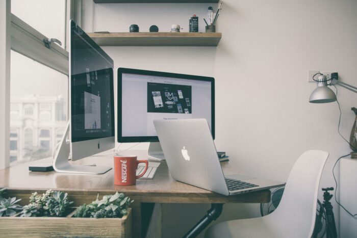 Desk with a laptop and a cup of coffee