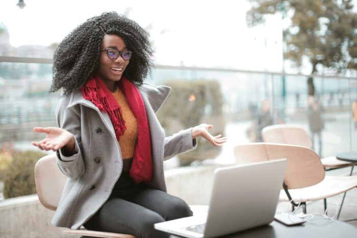 Woman sitting at a table with a laptop