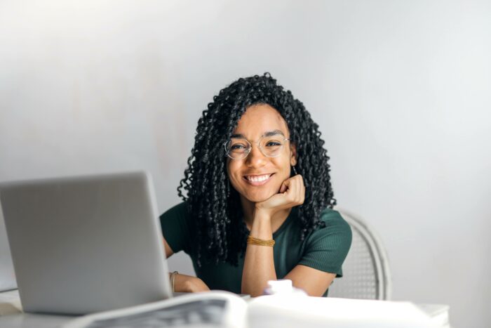 Woman sitting at a desk with her laptop