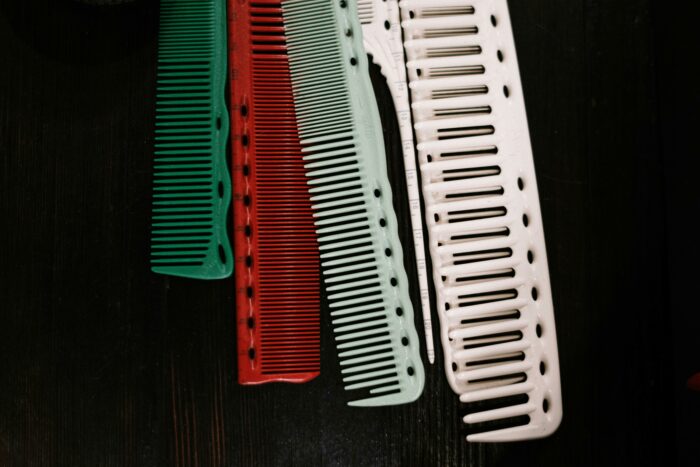 Bunch of different colored combs sitting on a table