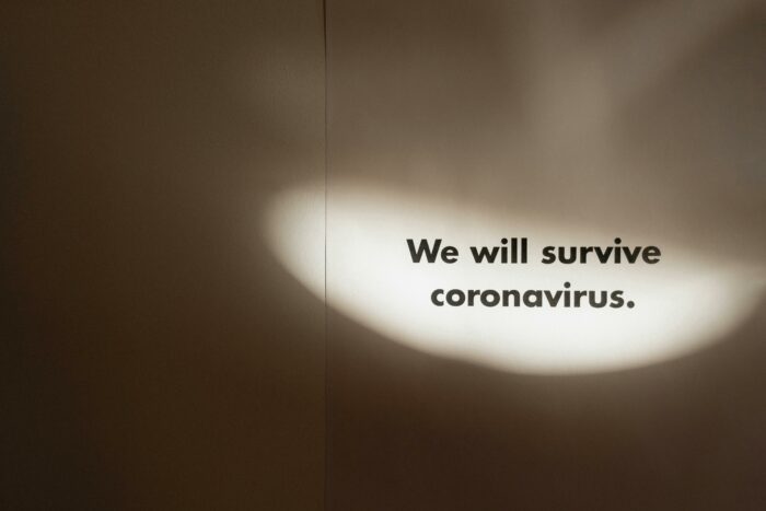 Wall with the words we will survive on it