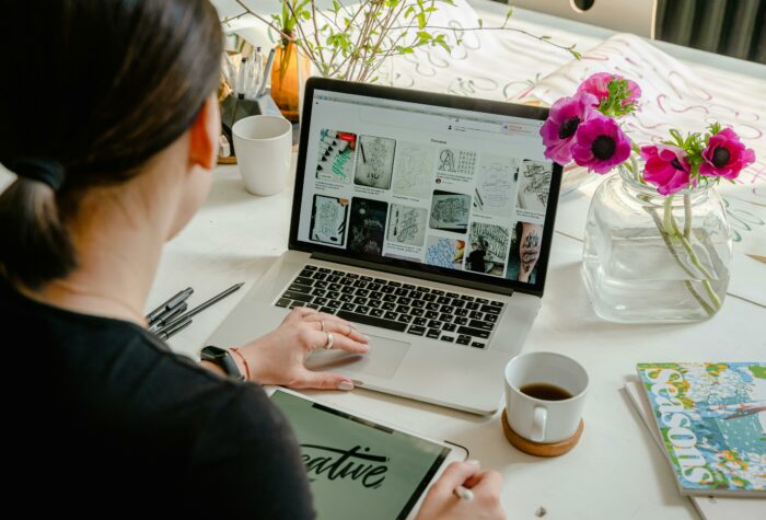 Woman sitting at a table with a laptop