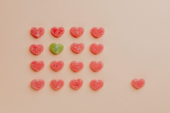 Heart shaped candis on a pink background