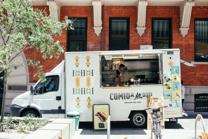Food truck parked in front of a building