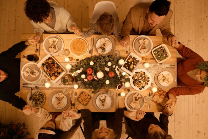 Group of people sitting around a dinner table