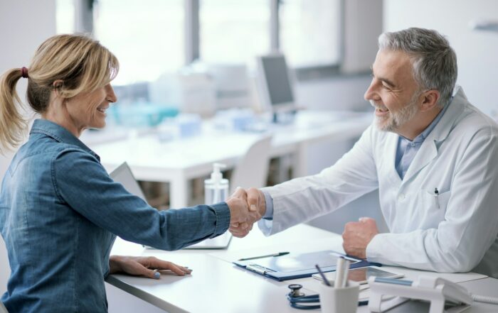 Doctor and patient shaking hands