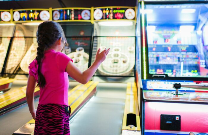 girl playing arcade games