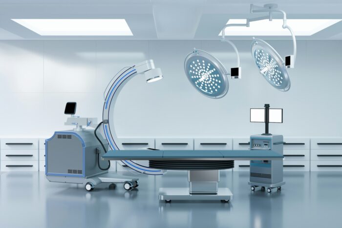 clean operating room with C arm and medical equipment