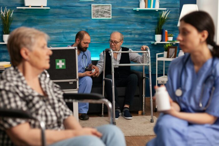 Nurses caring for patients in nursing home