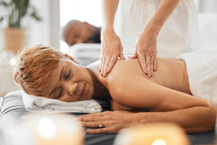 Spa, wellness and black woman at couple massage for romantic date, holiday and vacation. Relax, hea
