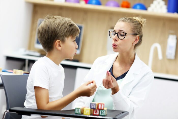 Cute little boy at speech therapist office