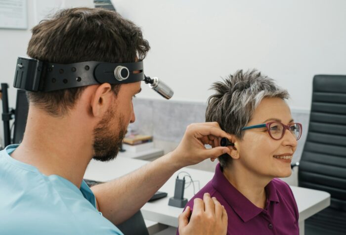 Otolaryngologist doctor treating ears, nose, and throat at hospital