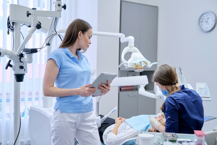 Portrait of dentist doctor with digital tablet