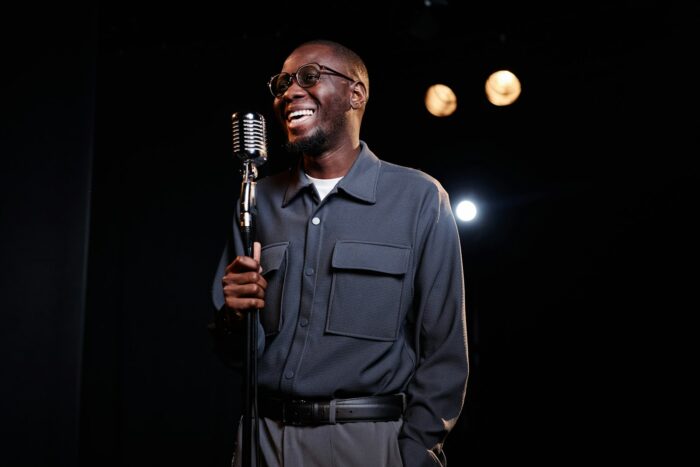 Smiling Black Man Performing in Comedy Show