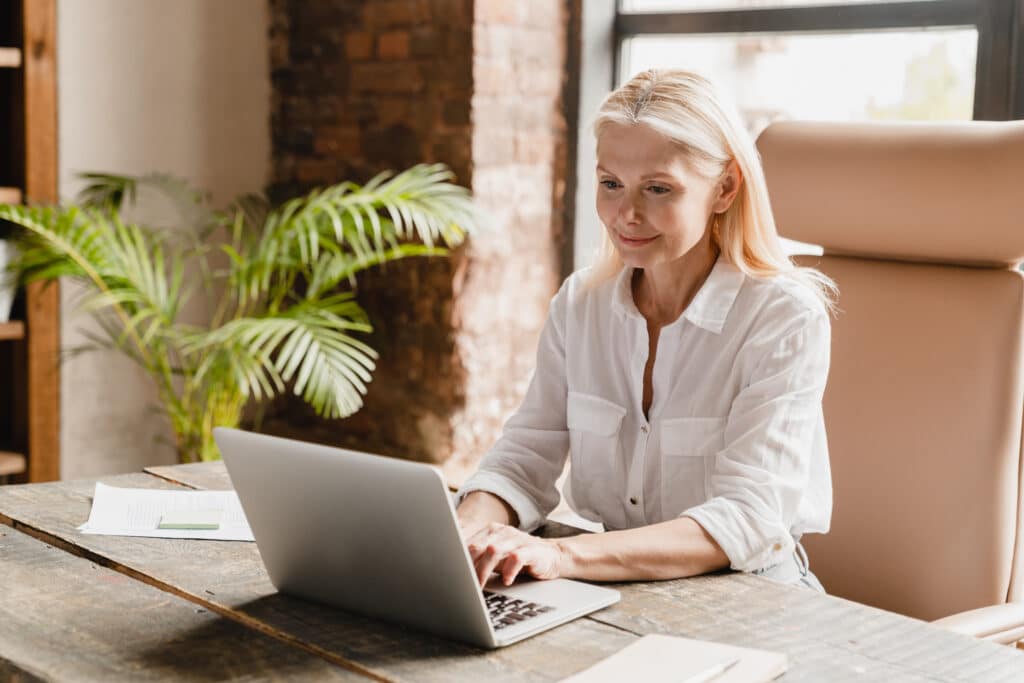 Business owner reviewing information on a laptop