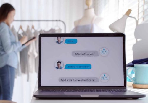 Chatbot conversation on laptop screen app interface with artificial intelligence technology