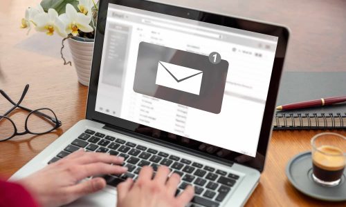 Email notification, woman hand on the computer laptop, one new inbox e mail message on the screen Email notification, woman hand on the computer laptop, one new inbox e mail message on the screen