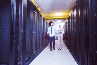 DIGITALON website hosting engineer showing working data center server room to female chief