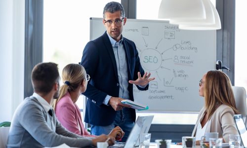 Handsome businessman explaining SEO digitalon seo sunshine coast