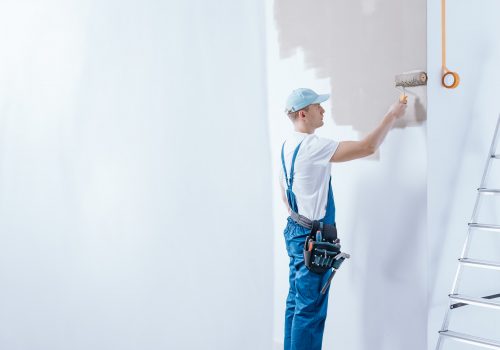 Painter in blue overalls
