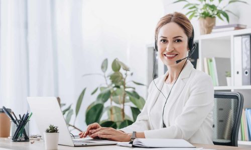 support operator working with headset and laptop in call center support operator working with headset and laptop in call center